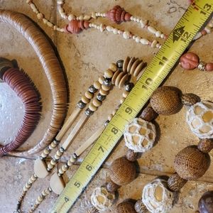 Brown collection of six beaded, wood and silver necklsces